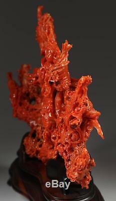 A Stunting Chinese Coral Carved Figural Group Guanyin, Dragons, Waves, Clouds