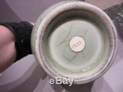 An antique Chinese celadon porcelain bottle vase, Ming dynasty