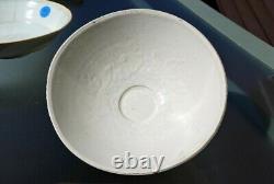 Two Chinese Yuan Qingbai Bowls one with molded lotus decoration 13th C