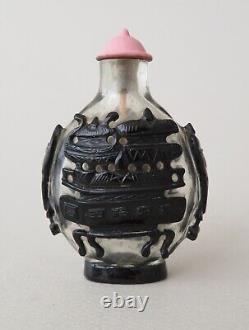 Bouteille à tabac chinoise fine en verre taillé noir, motif de bronzes Dings, époque Qing.